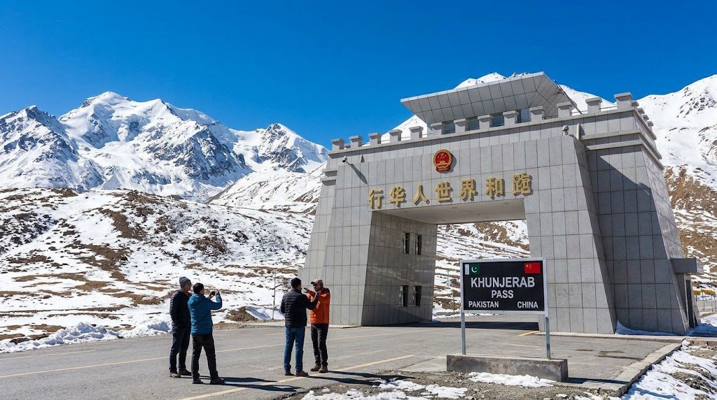 Why Pakistan China border travel feels special, featuring the scenic Khunjerab Pass, snow-covered Karakoram Mountains, and the Pakistan-China border crossing.