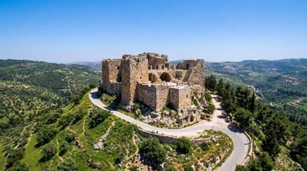 Ajloun Castle, one of the historic places to visit in Jordan, featuring medieval stone architecture and scenic hilltop views.